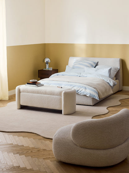 Clovarr Upholstered Bed in Bouclé
