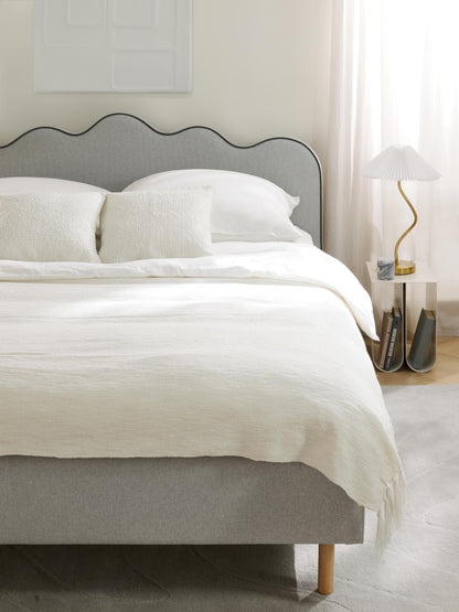 Romsleth Upholstered Bed with Wavy Headboard
